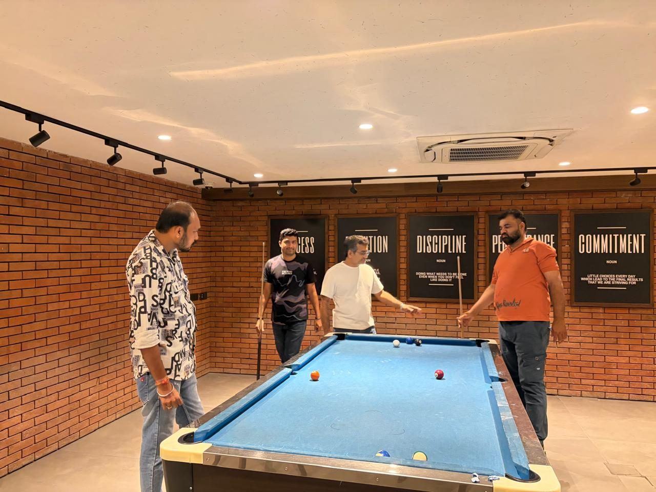 A snooker match in the office game room
